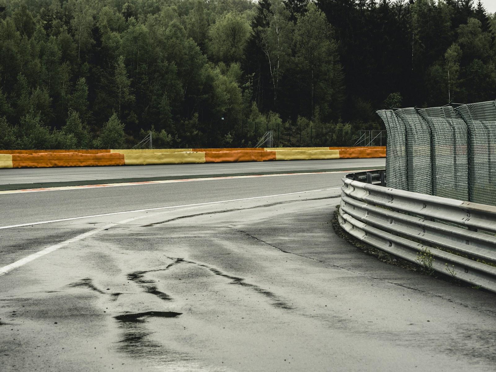 A racing circuit corner, kerbs and safety barriers — illustrative archive photograph